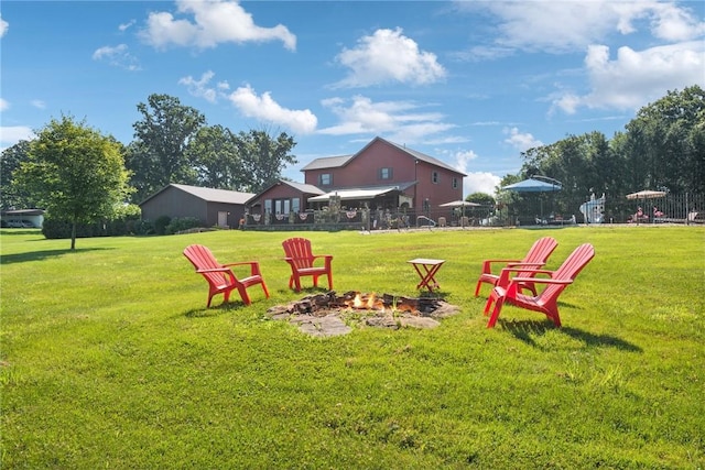 227 Holly Pl, Mount Pleasant Twp Wml, PA 15666 - view of grassy yard featuring a fire pit