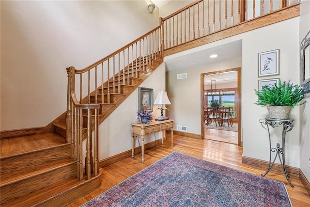 401 Pittsburgh St, Derry Twp, PA 15671 - stairs featuring wood finished floors and a high ceiling