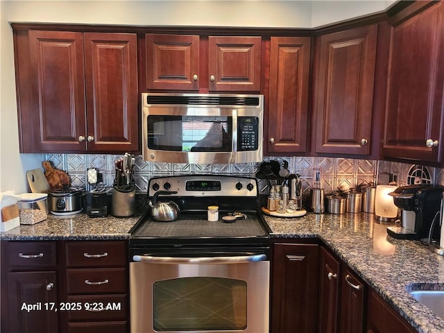 3381 Columbia Dr, Castle Shannon, PA 15234 - kitchen featuring stainless steel appliances, decorative backsplash, and dark stone counters