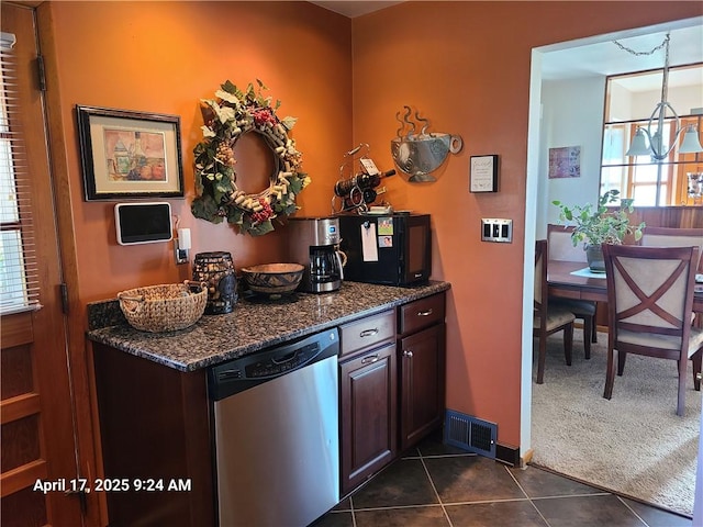 3381 Columbia Dr, Castle Shannon, PA 15234 - kitchen featuring dishwasher, plenty of natural light, dark tile patterned flooring, and dark brown cabinetry