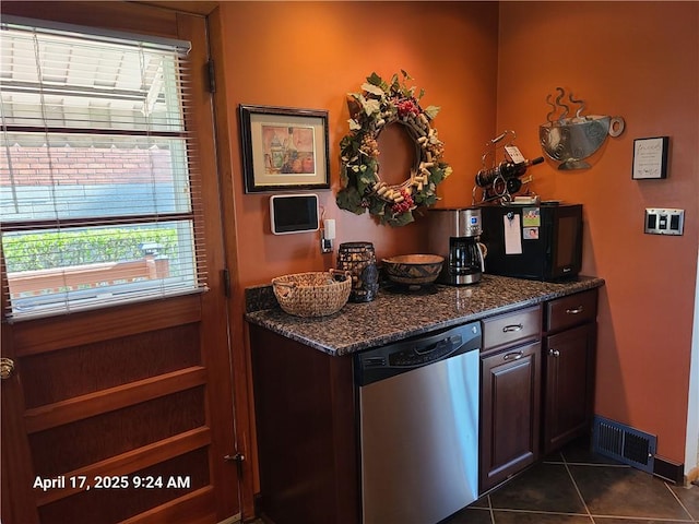 3381 Columbia Dr, Castle Shannon, PA 15234 - kitchen with stainless steel dishwasher, plenty of natural light, dark tile patterned flooring, and dark stone countertops