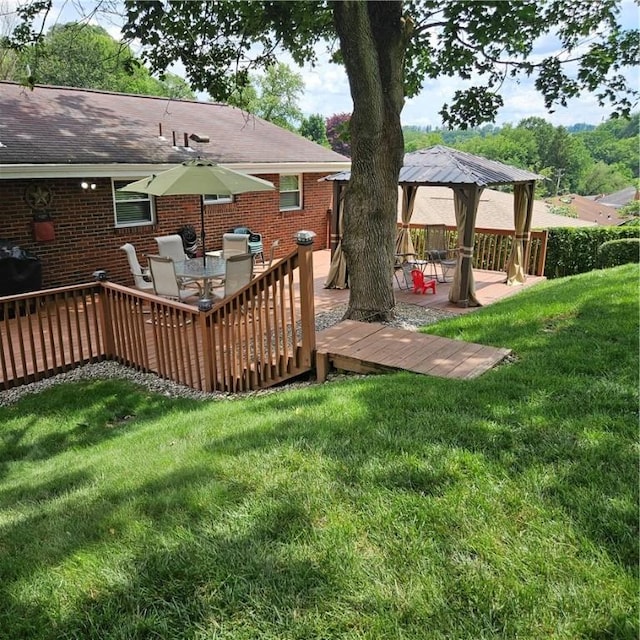 3381 Columbia Dr, Castle Shannon, PA 15234 - back of property with brick siding, a deck, a lawn, roof with shingles, and outdoor dining space