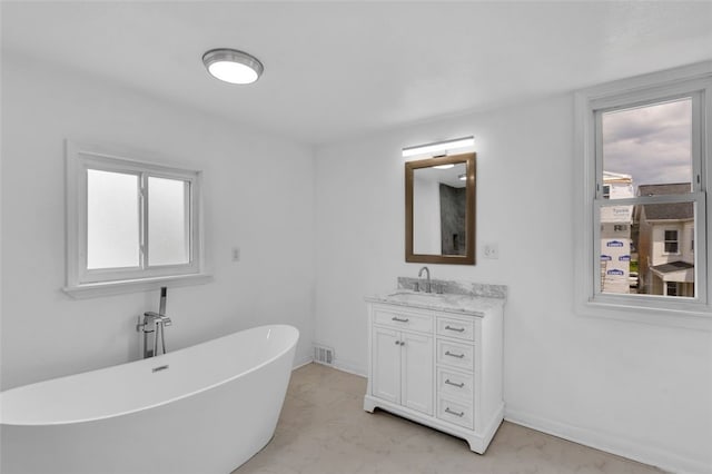 16 4th St, Sharpsburg, PA 15215 - bathroom with a soaking tub, plenty of natural light, and vanity
