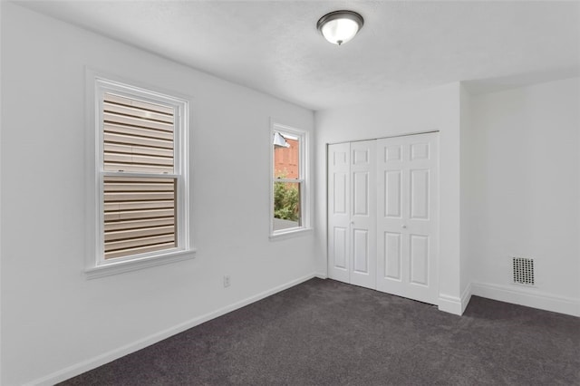 16 4th St, Sharpsburg, PA 15215 - unfurnished bedroom featuring dark carpet and a closet