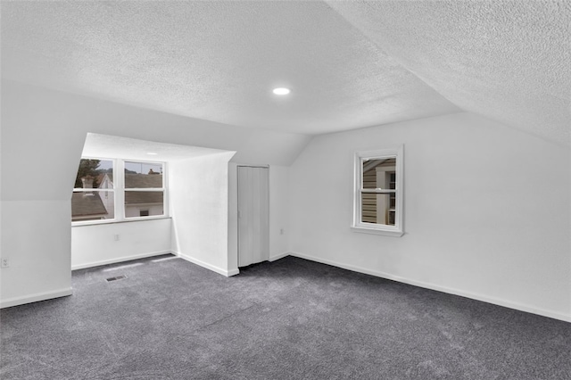 16 4th St, Sharpsburg, PA 15215 - additional living space with vaulted ceiling, dark carpet, a textured ceiling, and recessed lighting