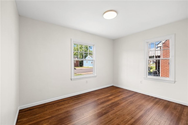 125 Carroll St, Aliquippa, PA 15001 - spare room with dark wood-style flooring and baseboards