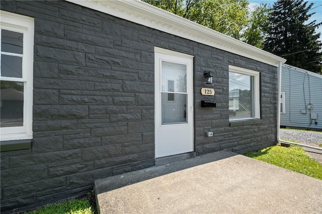 125 Carroll St, Aliquippa, PA 15001 - doorway to property with a patio and stone siding