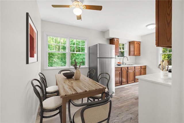 125 Carroll St, Aliquippa, PA 15001 - dining space with light wood-style flooring and a ceiling fan