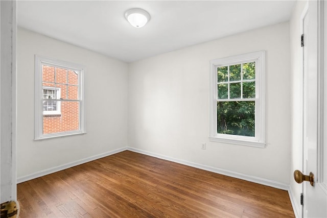 125 Carroll St, Aliquippa, PA 15001 - spare room featuring wood finished floors and baseboards