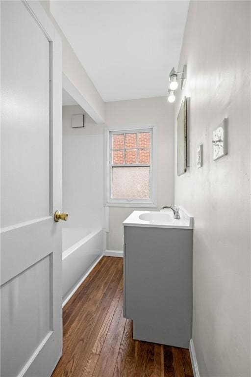 125 Carroll St, Aliquippa, PA 15001 - bathroom with vanity, wood finished floors, and a bath