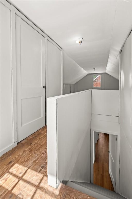 125 Carroll St, Aliquippa, PA 15001 - staircase featuring lofted ceiling and wood finished floors