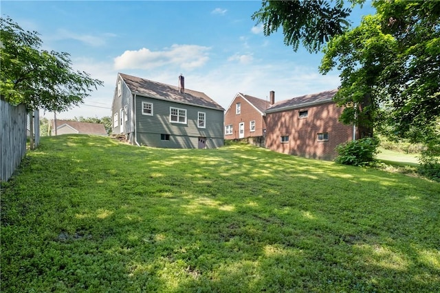 125 Carroll St, Aliquippa, PA 15001 - rear view of house with a yard