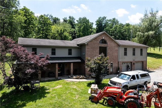 207 Linden Rd, North Strabane, PA 15317 - view of front of property featuring brick siding, a garage, and a front lawn