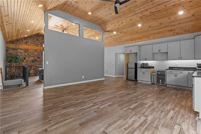 207 Linden Rd, North Strabane, PA 15317 - kitchen featuring beverage cooler, high vaulted ceiling, dark countertops, freestanding refrigerator, and open floor plan