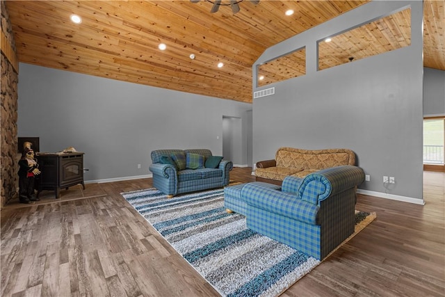 207 Linden Rd, North Strabane, PA 15317 - living area featuring high vaulted ceiling, wood ceiling, wood finished floors, a wood stove, and recessed lighting
