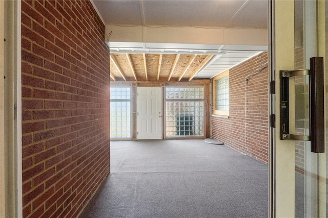 410 Blackhawk Rd, Chippewa Twp, PA 15010 - corridor with brick wall and carpet flooring