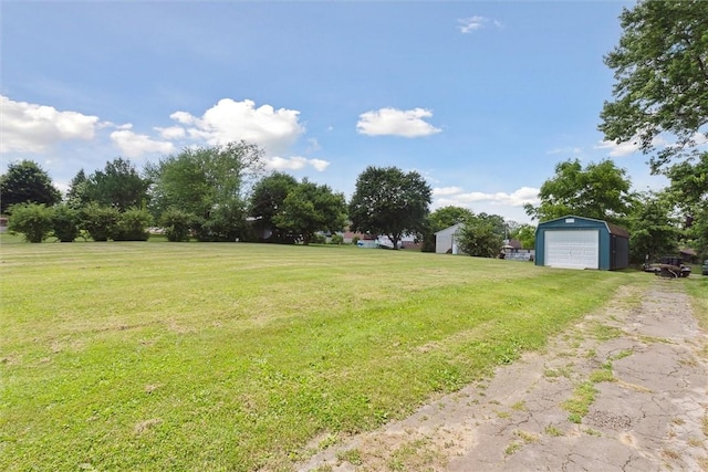 410 Blackhawk Rd, Chippewa Twp, PA 15010 - view of grassy yard featuring a detached garage, an outdoor structure, and driveway
