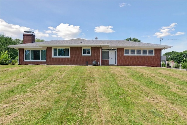 410 Blackhawk Rd, Chippewa Twp, PA 15010 - view of front of property featuring brick siding, a front lawn, and a chimney