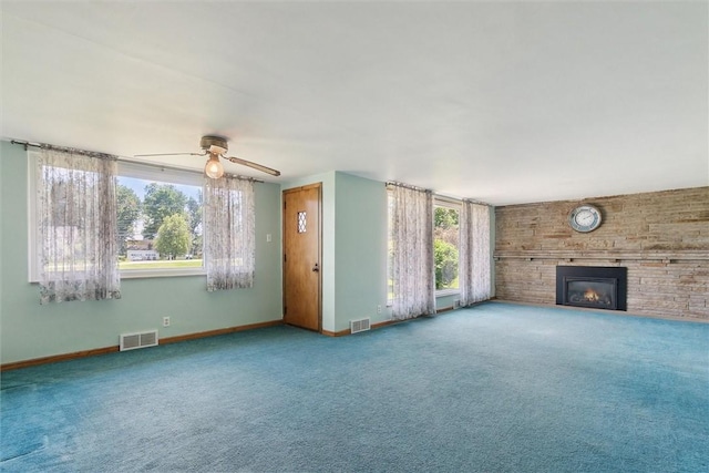 410 Blackhawk Rd, Chippewa Twp, PA 15010 - unfurnished living room with a fireplace, carpet flooring, and ceiling fan
