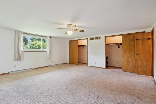410 Blackhawk Rd, Chippewa Twp, PA 15010 - unfurnished bedroom featuring multiple closets, baseboard heating, light colored carpet, and a ceiling fan
