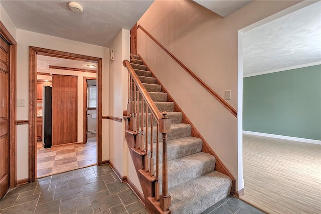 1318 Dellview Dr, Unity Twp, PA 15601 - staircase with baseboards and stone finish floors