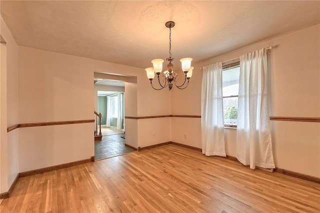 1318 Dellview Dr, Unity Twp, PA 15601 - unfurnished room with a chandelier and light wood-type flooring