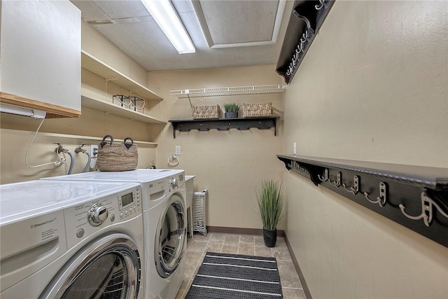 1318 Dellview Dr, Unity Twp, PA 15601 - laundry room with washer and dryer, cabinet space, and light stone finish flooring