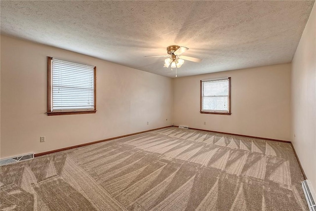 1318 Dellview Dr, Unity Twp, PA 15601 - unfurnished room featuring light colored carpet, a ceiling fan, baseboard heating, and a textured ceiling