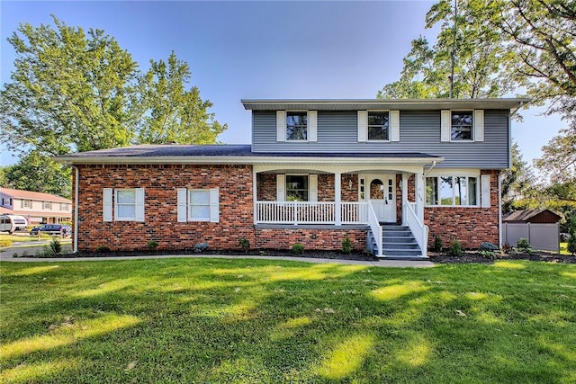 1318 Dellview Dr, Unity Twp, PA 15601 - traditional-style house featuring brick siding, a front lawn, and covered porch
