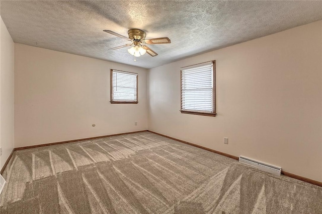 1318 Dellview Dr, Unity Twp, PA 15601 - carpeted empty room featuring a ceiling fan, a baseboard heating unit, and a textured ceiling