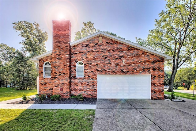 1318 Dellview Dr, Unity Twp, PA 15601 - view of property exterior featuring concrete driveway, brick siding, and a chimney