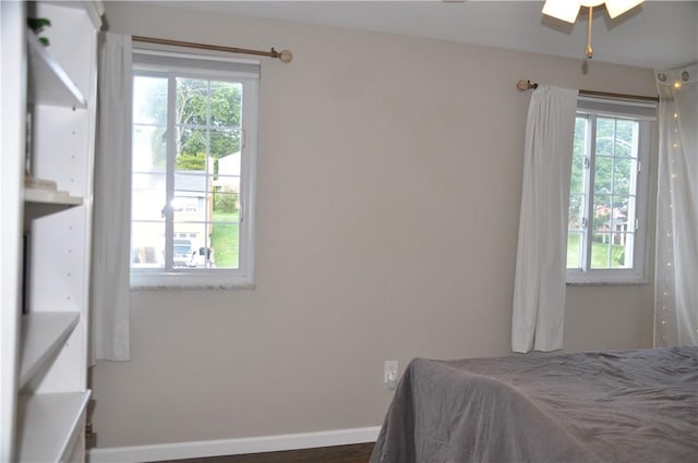 5676 Marilynn Dr, Bethel Park, PA 15236 - bedroom with multiple windows, dark wood finished floors, and a ceiling fan