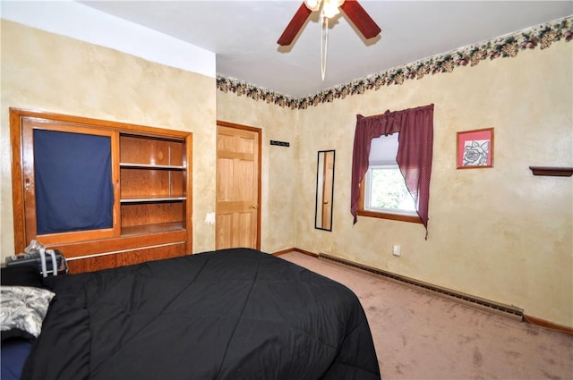3411 York St, Mckeesport, PA 15132 - carpeted bedroom with a baseboard radiator and ceiling fan