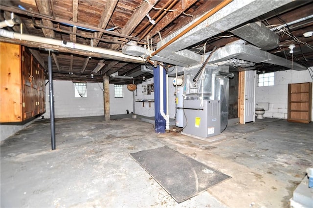 3411 York St, Mckeesport, PA 15132 - basement featuring heating unit and concrete block wall