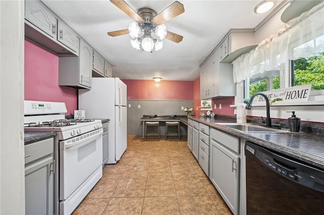 665 Stuchell Rd, Burrel/Blacklick, PA 15748 - kitchen with white appliances, dark countertops, gray cabinetry, ceiling fan, and light tile patterned floors
