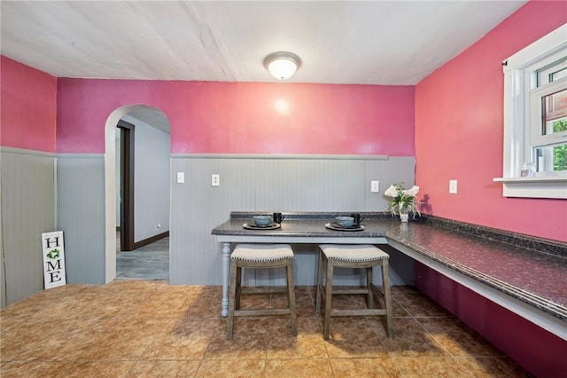 665 Stuchell Rd, Burrel/Blacklick, PA 15748 - tiled dining space with a wainscoted wall and arched walkways