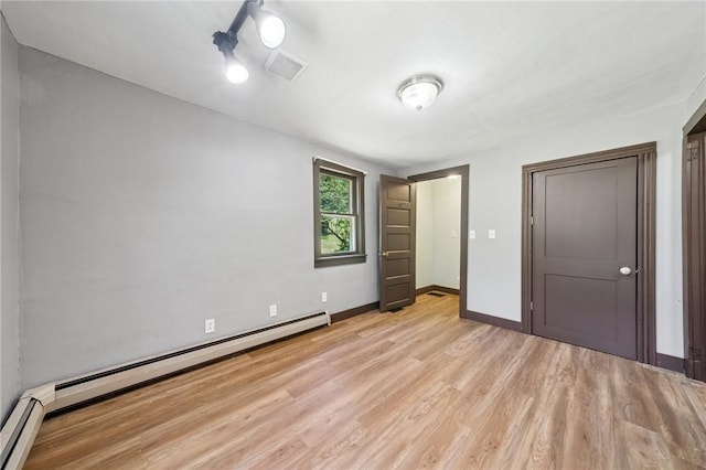 665 Stuchell Rd, Burrel/Blacklick, PA 15748 - unfurnished bedroom featuring a baseboard radiator and light wood-type flooring