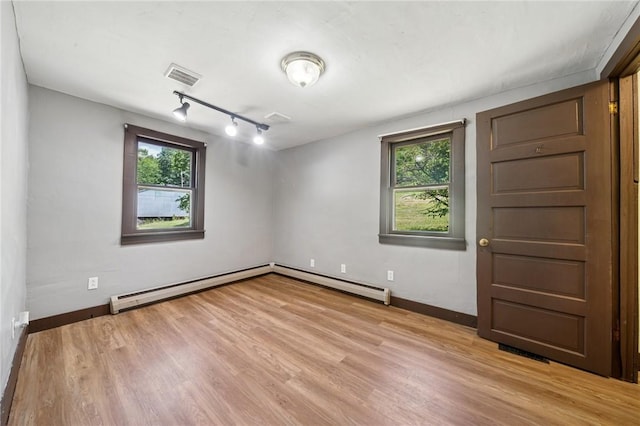 665 Stuchell Rd, Burrel/Blacklick, PA 15748 - empty room with track lighting, healthy amount of natural light, and light wood-style flooring