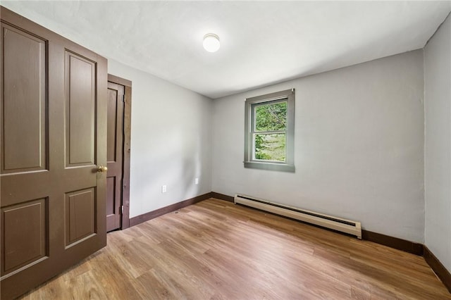 665 Stuchell Rd, Burrel/Blacklick, PA 15748 - unfurnished bedroom featuring a baseboard heating unit and light wood-type flooring