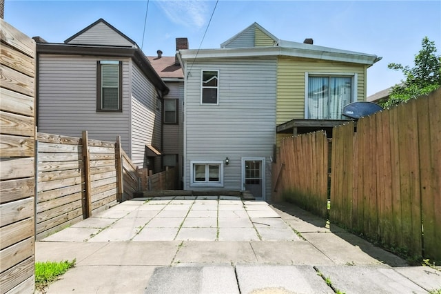 227 Henderson St, Fineview, PA 15212 - back of property featuring a patio and a fenced backyard