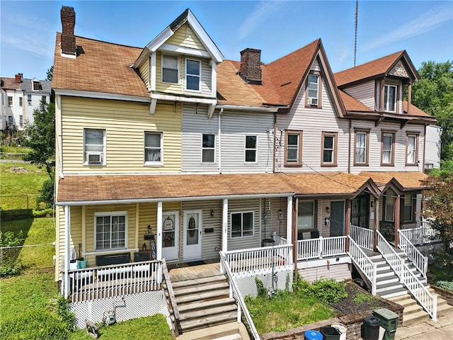 227 Henderson St, Fineview, PA 15212 - townhome / multi-family property featuring a porch, a chimney, and stairs
