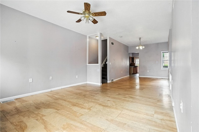 227 Henderson St, Fineview, PA 15212 - unfurnished living room with stairs, a ceiling fan, a chandelier, and light wood-style flooring