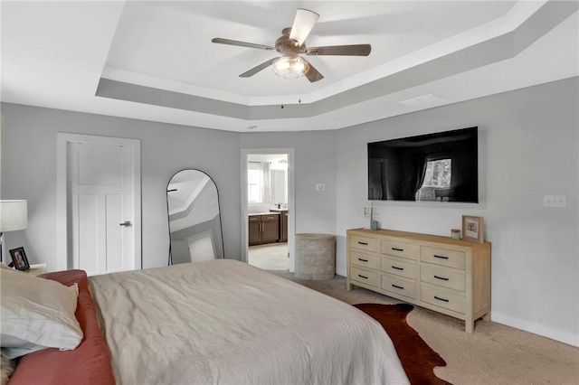 212 Bengal Fox, Jackson Twp, PA 16063 - bedroom featuring a tray ceiling, light colored carpet, ensuite bath, and ceiling fan