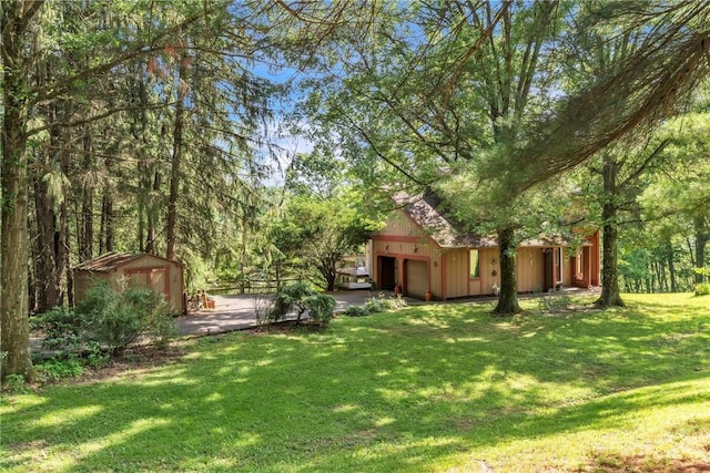 530 Perry Hwy, Lancaster Twp, PA 16037 - view of grassy yard with a shed and a garage