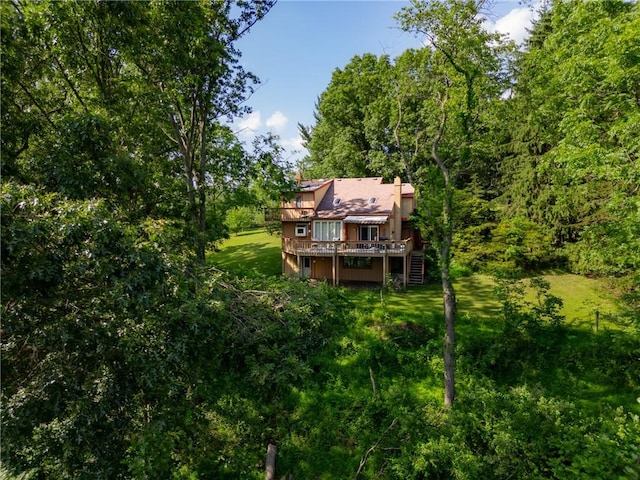 530 Perry Hwy, Lancaster Twp, PA 16037 - back of property with stairs, a wooden deck, and a yard