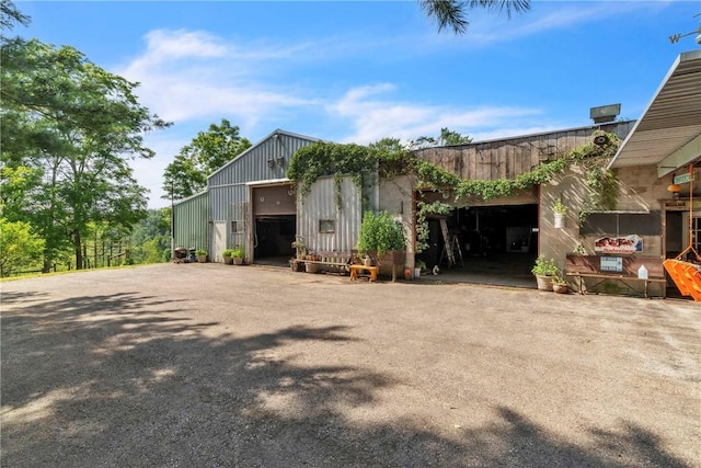 530 Perry Hwy, Lancaster Twp, PA 16037 - view of front facade featuring a garage and board and batten siding