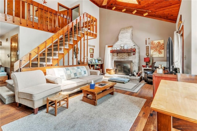 530 Perry Hwy, Lancaster Twp, PA 16037 - living room with wood finished floors, high vaulted ceiling, a fireplace, wood ceiling, and stairs