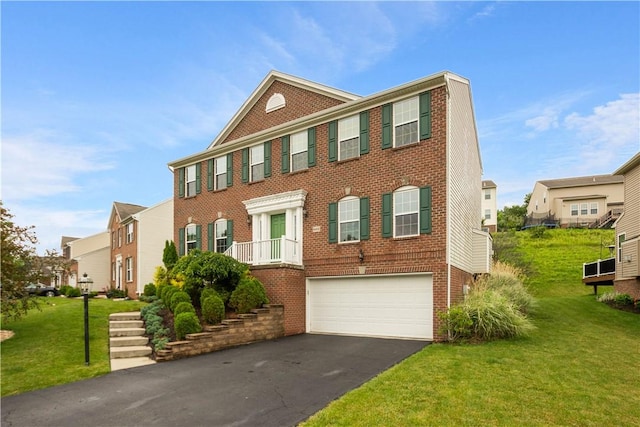 6412 Interlaken Dr, South Fayette, PA 15057 - view of front of house featuring brick siding, driveway, a garage, a front lawn, and a residential view