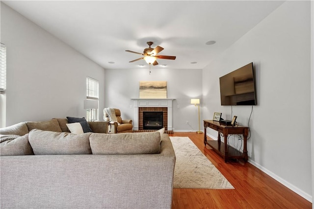 6412 Interlaken Dr, South Fayette, PA 15057 - living area featuring ceiling fan, wood finished floors, and a fireplace