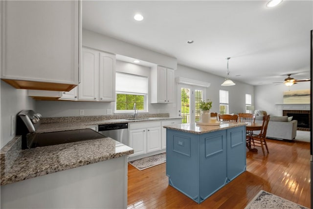 6412 Interlaken Dr, South Fayette, PA 15057 - kitchen featuring range with electric stovetop, stainless steel dishwasher, white cabinets, a center island, and recessed lighting